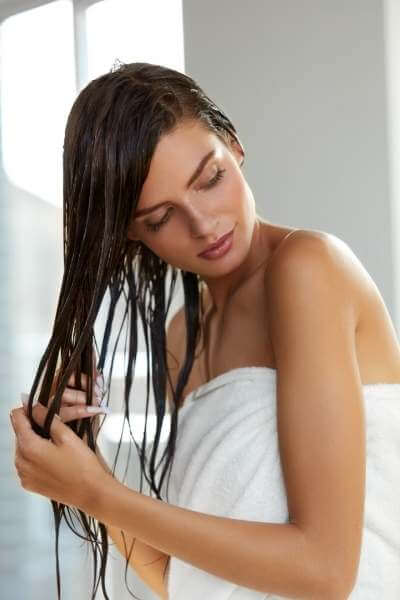 Hair Care. Beautiful Woman With Wet Hair In Towel After Bath